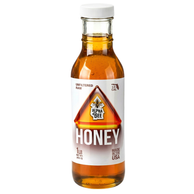 Bottle of Alpha Bee honey on a white background hide